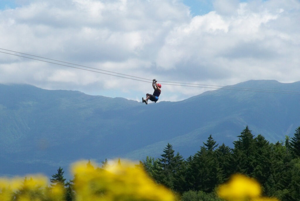 Person ziplining at Bretton Woods