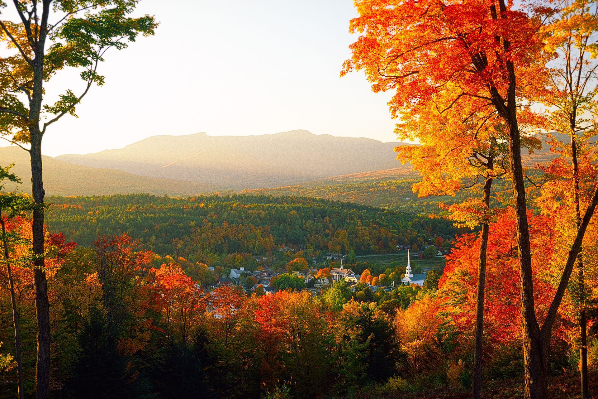 View of Mt. Mansfield and the town of Stowe at sunset on a beautiful fall day